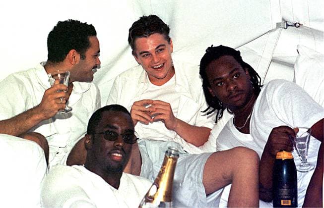 September 7, 1998, East Hampton, New York, USA: SEAN PUFFY P DIDDY COMBS (front center) and LEONARDO DICAPRIO .(back center) at Combs labor day party at .his house in East Hampton. In 1998, Sean Combs, aka Diddy, announced his arrival in the East Hampton by throwing a Labor Day party at his new house on Hedges Banks Drive. What the hip-hop mogul delivered was the inaugural installment of a series of summer White Parties that eventually moved to St. Tropez and Beverly Hills. East Hamptons USA - ZUMAg49_ 19980907_ent_g49_545 Copyright: xGlobexPhotosx