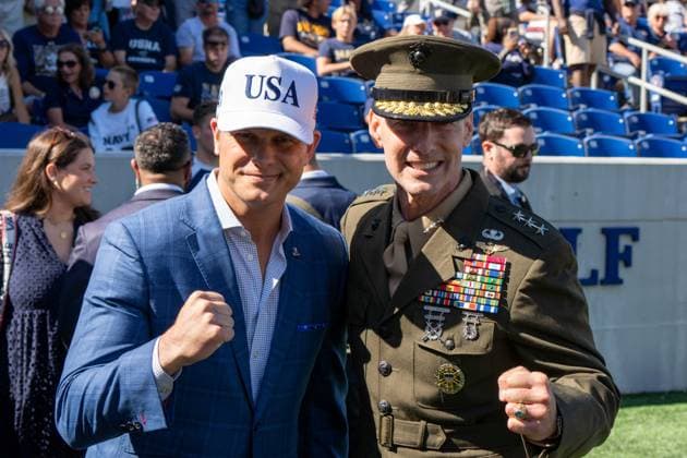 October 4, 2025, Annapolis, Maryland, USA: Secretary of War PETE HEGSETH and United States Naval Academy Superintendent Marine Corps Lieutenant General MICHAEL J. BORGSCHULTE raise their fists to pose for a photo at the Navy vs. Air Force football game. Annapolis USA - ZUMAs365 20251004_znp_s365_001 Copyright: xJoeyxSussmanx