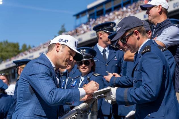 October 4, 2025, Annapolis, Maryland, USA: Secretary of War PETE HEGSETH signs an Air Force Academy Cadet Contrail Book at the Navy vs. Air Force football game. Annapolis USA - ZUMAs365 20251004_znp_s365_024 Copyright: xJoeyxSussmanx