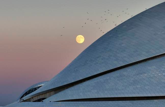 (251006) -- BEIJING, Oct. 6, 2025 -- A drone photo taken on Oct. 6, 2025 shows a full moon over the sky in Harbin, northeast China s Heilongjiang Province. Monday marks this year s Mid-Autumn Festival, which is celebrated annually on the 15th day of the eighth month in the Chinese lunar calendar. People across China admire the full moon to celebrate the traditional holiday. (Photo by Xinhua) CHINA-MID-AUTUMN FESTIVAL-MOON (CN) ZhangxShu 