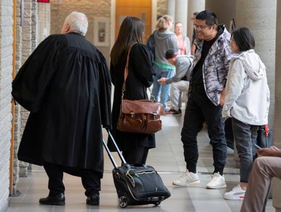 October 6, 2025, Longueuil, Pq, CANADA: Yuesheng Wang, second right meets with his lawyers as he arrives for his espionage trial at the Longueuil courthouse in Longueuil, Que., on Monday, Oct. 6, 2025. Longueuil CANADA  - ZUMAc35_ 20251006_zaf_c35_004 Copyright: xChristinnexMuschix