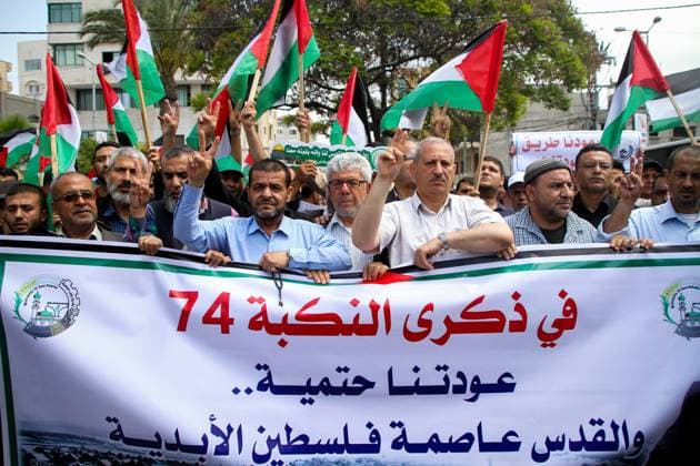 Palestinians commemorate Nakba day in Gaza May 15, 2022, Gaza City, Gaza Strip, Palestine: Gaza, Palestine. 15 May 2022. Palestinian National and Islamic Forces organise a mass rally to mark the 74th anniversary of the Nakba or Ã¢â‚¬oePalestinian catastropheÃ¢â‚¬Â, in front of the United Nations headquarters in Gaza City. Participants waived the Palestinian flag and raised posters upholding their right to return. Nakba day coincides with the establishment of the state of Israel in 1948, which led to the flight of 750,000 Palestinians who were expelled o fled from their land at that time. The Nakba is a very painful moment for Palestinians as they remember their tragic history and the loss of their land Copyright: xAhmadxHasaballahx