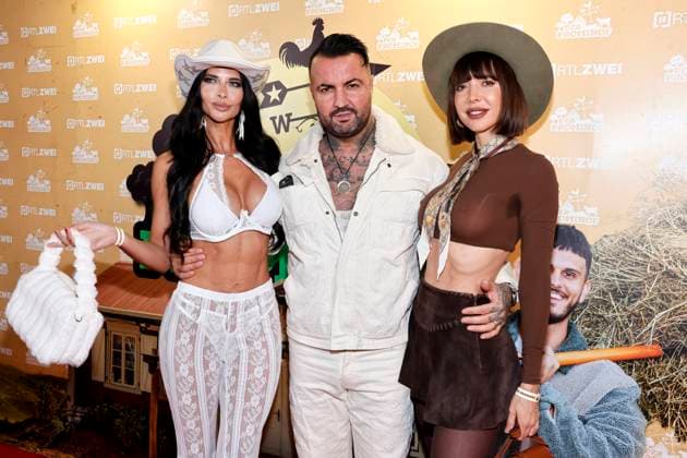 Erotic model Micaela Schäfer, singer Cosimo Citiolo and performance artist Milo Moire at the premiere party of RTL2s Der Promihof at the Gertrudenhof Hürth, 09 10 2025 NRW Germany Copyright: xChristophxHardtx