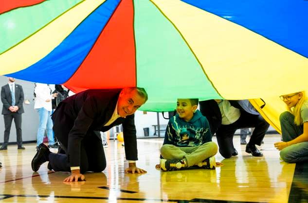 October 10, 2025, Ottawa, On, CAN: Prime Minister Mark Carney plays a parachute game with children at a community centre, before participating in an announcement in Ottawa, on Friday, Oct. 10, 2025. Ottawa CAN  - ZUMAc35_ 20251010_zaf_c35_006 Copyright: xJustinxTangx