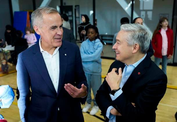 October 10, 2025, Ottawa, On, CAN: Prime Minister Mark Carney jokes with Minister of Finance and National Revenue Francois-Philippe Champagne as they greet families before participating in an announcement at a community centre in Ottawa, on Friday, Oct. 10, 2025. Ottawa CAN  - ZUMAc35_ 20251010_zaf_c35_014 Copyright: xJustinxTangx