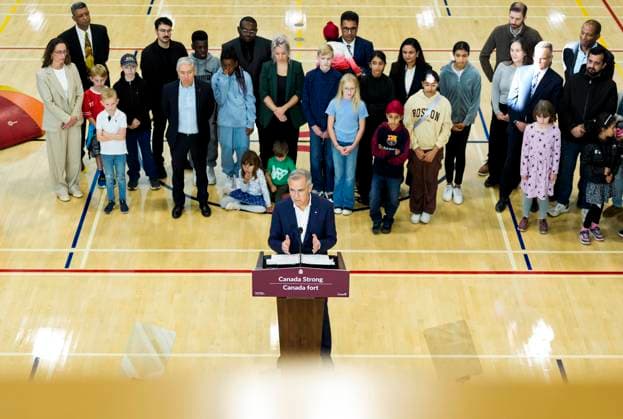 October 10, 2025, Ottawa, On, CAN: Children and families listen as Prime Minister Mark Carney speaks during an announcement at a community centre in Ottawa, on Friday, Oct. 10, 2025. Ottawa CAN  - ZUMAc35_ 20251010_zaf_c35_020 Copyright: xJustinxTangx
