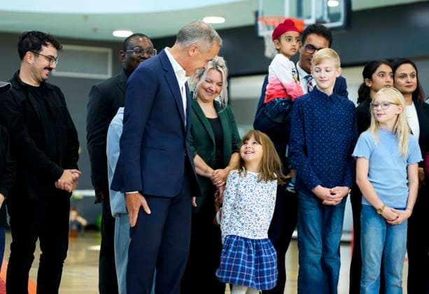 October 10, 2025, Ottawa, On, CAN: Prime Minister Mark Carney jokes with a youngster about the posture they will have to take as they stand in the background before an announcement at a community centre in Ottawa, on Friday, Oct. 10, 2025. Ottawa CAN  - ZUMAc35_ 20251010_zaf_c35_022 Copyright: xJustinxTangx