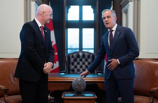 October 10, 2025, Ottawa, On, Canada: Prime Minister Mark Carney, right, speaks about the ball Mexican President Claudia Sheinbaum presented him with, as he is seen with FIFA President Gianni Infantino, left, in his office on Parliament Hill in Ottawa, Friday, Oct. 10, 2025. Ottawa Canada - ZUMAc35_ 20251010_zaf_c35_075 Copyright: xAdrianxWyldx