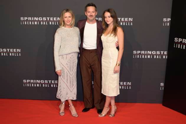 Springsteen Liberami dal nulla red carpet in Rome, Italy - 10 Oct 2025 Jocelyne Cooper (l), Scott Cooper (c) and Ava Cooper (r) attend the Springsteen Liberami dal Nulla movie red carpet at The Space Cinema Moderno. Rome Italy Copyright: xMarioxCartellix xSOPAxImagesx _DSC4513