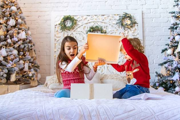 Children open Christmas gifts under the tree. Selective focus. Children open Christmas gifts under the tree. Selective focus. Kid., model released, , 59748282.jpg RECORD DATE NOT STATED