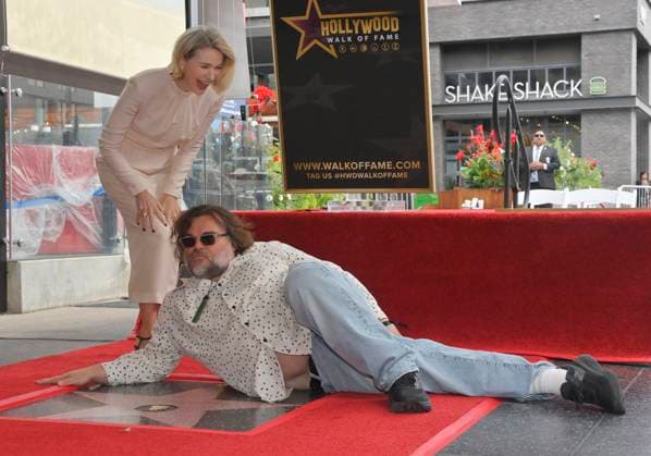 Actress Naomi Watts reacts as actor Jack Black lies on her star during an unveiling ceremony honoring her with the 2,825th star on the Hollywood Walk of Fame in Los Angeles on Monday, October 13, 2025.  LAP2025101317 JIMxRUYMEN