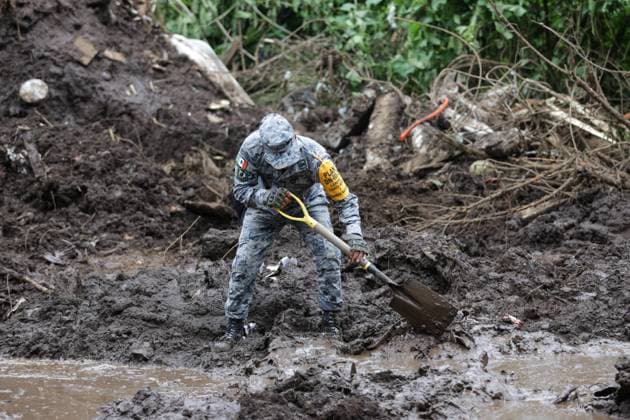 251013 -- HUAUCHINANGOMEXICO, Oct. 13, 2025 -- This photo taken on Oct. 13, 2025 shows a rescue worker conducts a search in a landslide caused by the heavy rain in Huauchinango, Puebla state, Mexico. At least 64 people have died and dozens remain missing after days of torrential rains and flooding that hit central and eastern Mexico last week, authorities said Monday. Photo by Francisco Canedo Xinhua MEXICO-HUAUCHINANGO-HEAVY RAIN-AFTERMATH FuxLangxisikekanieduo  MEXICO-HUAUCHINANGO-HEAVY RAIN-AFTERMATH IMAGO FuxLangxisikeÂ¡Â¤kanieduo  imago images 1067747621