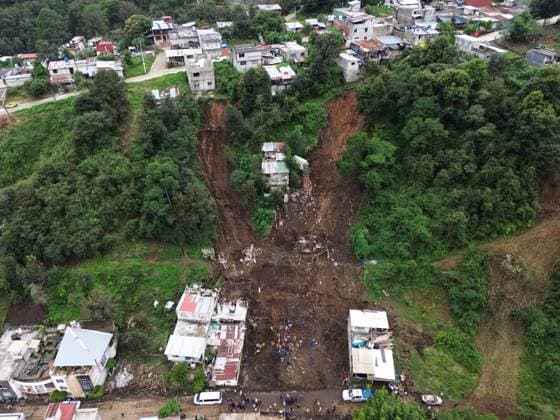 251013 -- HUAUCHINANGOMEXICO, Oct. 13, 2025 -- This drone photo taken on Oct. 13, 2025 shows the aftermath after a landslide caused by the heavy rain in Huauchinango, Puebla state, Mexico. At least 64 people have died and dozens remain missing after days of torrential rains and flooding that hit central and eastern Mexico last week, authorities said Monday. Photo by Francisco Canedo Xinhua MEXICO-HUAUCHINANGO-HEAVY RAIN-AFTERMATH FuxLangxisikekanieduo  MEXICO-HUAUCHINANGO-HEAVY RAIN-AFTERMATH IMAGO FuxLangxisikeÂ¡Â¤kanieduo  imago images 1067747647