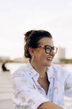 Happy woman with glasses laughing outdoors Warsaw, Masovian Voivodeship, Poland R_YUKI251013A-1829244-01 EDITORIAL USE ONLY