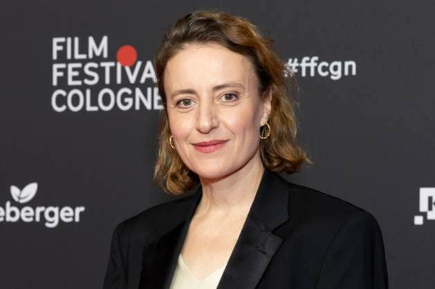Actress Maren EGGERT mi , laureate International Actors Award 2025, portrait, portrait, friendly, half figure, laughing, red carpet, at the Film Festival Cologne, at the Filmpalast Koeln, on 16 10 2025
