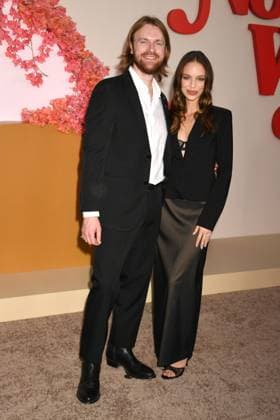 LOS ANGELES, CA - OCTOBER 16: Finneas O Connell and Claudia Sulewski at the Netflix Premiere of Nobody Wants This at The Egyptian Theatre on October 16, 2025 in Los Angeles, California. Copyright: xJeffreyxMayerx