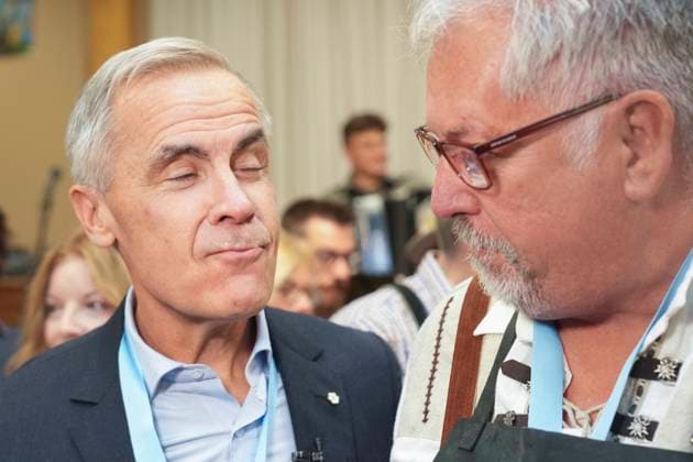 October 17, 2025, Breslau, On, Canada: Prime Minister Mark Carney, left, displays his beer moustache after taking a sip of beer with Darryl Fletcher, President of the Board of Oktoberfest, at an Oktoberfest event, at the Schwaben Club in Breslau, Ont., on Friday, Oct. 17, 2025. Breslau Canada - ZUMAc35_ 20251017_zaf_c35_041 Copyright: xChrisxYoungx