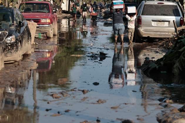 October 17, 2025, Veracruz, Poza Rica, Mexico: One week after Tropical Storm RAYMOND caused severe damage and flooding in Poza Rica, Veracruz, a caravan of Mexican Red Cross personnel delivered humanitarian aid, provided health services, and provided free internet access to contact or search for missing relatives in the most affected areas of this municipality. The oÂlamo region was the hardest hit, where water swept away vehicles and furniture, and even completely covered some homes due to overflowing rivers. This also damaged communication and electricity services. The cleanup work has been carried out largely by residents themselves, as they are in areas that are difficult to access due to the enormous amount of mud covering their stre - ZUMAp204 20251017_zip_p204_096 Copyright: xJosuexPerezx