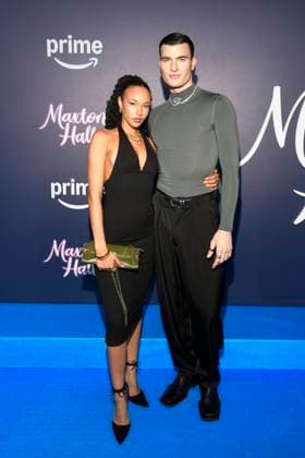 abb Maxton Hall Frieder Sell with companion on the blue carpet at the premiere of the Amazon Prime TV series Maxton Hall The World Between Us Season 2 at Tempodrom on 17 10 2025 in Berelin Berlin Germany