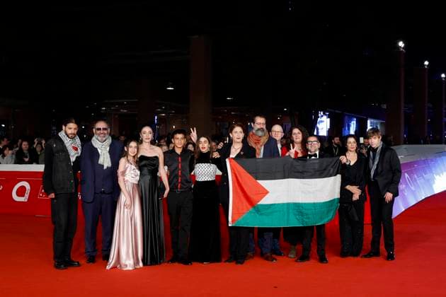 October 18, 2025, Rome, ITALY: Cast pose with a Palestinian flag as arrive for the screening of the movie ˜Palestine 36™ at the 20th annual Rome International Film Fest in Rome, Italy, 18 October 2025. The Festa del Cinema di Roma runs from 15 to 26 October 2025. ANSA FABIO FRUSTACI. Rome ITALY  - ZUMAa110 20251018_zaf_a110_060 Copyright: xFabioxFrustacix