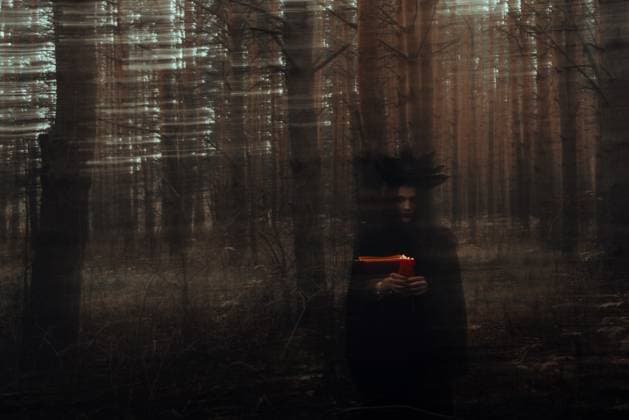 dark terrible witch with candles in her hands performs an occult mystical ritual in the forest dark terrible witch with candles in her hands performs an occult mystical ritual in the forest. Blurry photo with blurring due to long exposure time, model released, , 60642622.jpg RECORD DATE NOT STATED