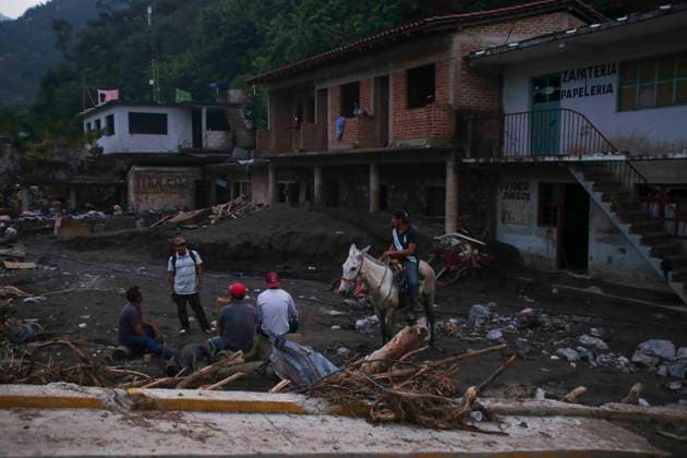 October 20, 2025, Mexico City, Mexico City, Mexico: Damage caused by Hurricane Priscila in the municipality of Huehuetla in the OtomoÂ­ Tepehua mountain range, one of the most affected municipalities in the state of Hidalgo, due to its proximity to the Pantepec River, houses completely filled with mud and cars buried. Mexico City Mexico - ZUMAs310 20251020_zip_s310_001 Copyright: xLuisxExSalgadox
