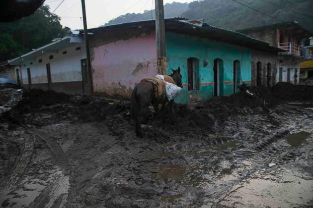 October 20, 2025, Mexico City, Mexico City, Mexico: Damage caused by Hurricane Priscila in the municipality of Huehuetla in the OtomoÂ­ Tepehua mountain range, one of the most affected municipalities in the state of Hidalgo, due to its proximity to the Pantepec River, houses completely filled with mud and cars buried. Mexico City Mexico - ZUMAs310 20251020_zip_s310_007 Copyright: xLuisxExSalgadox