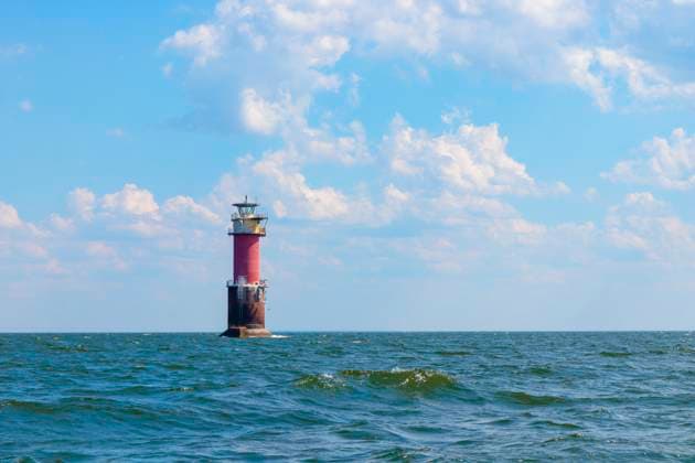 A lighthouse in the Baltic Sea in the Gulf of Finland near Tallinn, Estonia. Blue morning sky, clouds, waves, sea. Banner with copy space A lighthouse in the Baltic Sea in the Gulf of Finland near Tallinn, Estonia. Blue morning sky, clouds, waves, sea. Banner with copy space, 60849052.jpg RECORD DATE NOT STATED