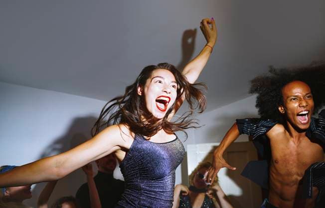 Friends dancing and celebrating together at a lively home party model released, Symbolfoto, AZF00907