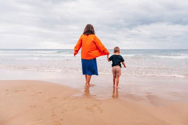 Mother and son walking barefoot together at the beach during vacation model released, Symbolfoto, KVBF00552