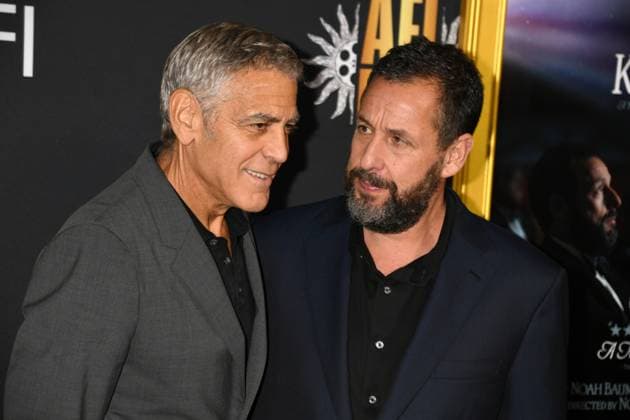 LOS ANGELES, CA - OCTOBER 23: George Clooney and Adam Sandler at the AFI Fest 2025 Premiere of Jay Kelly at TCL Chinese Theatre on October 23, 2025 in Los Angeles, California. Copyright: xJeffreyxMayerx