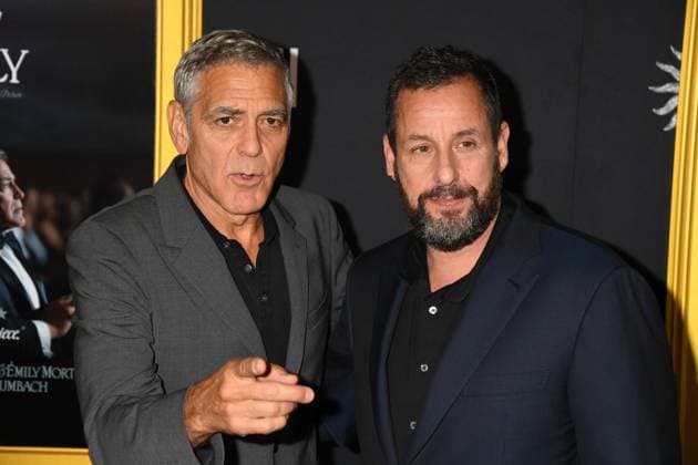 LOS ANGELES, CA - OCTOBER 23: George Clooney and Adam Sandler at the AFI Fest 2025 Premiere of Jay Kelly at TCL Chinese Theatre on October 23, 2025 in Los Angeles, California. Copyright: xJeffreyxMayerx