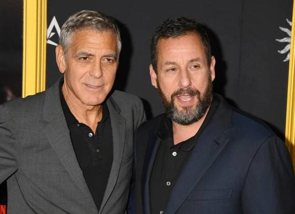 LOS ANGELES, CA - OCTOBER 23: George Clooney and Adam Sandler at the AFI Fest 2025 Premiere of Jay Kelly at TCL Chinese Theatre on October 23, 2025 in Los Angeles, California. Copyright: xJeffreyxMayerx