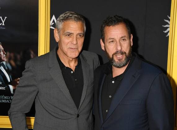 LOS ANGELES, CA - OCTOBER 23: George Clooney and Adam Sandler at the AFI Fest 2025 Premiere of Jay Kelly at TCL Chinese Theatre on October 23, 2025 in Los Angeles, California. Copyright: xJeffreyxMayerx