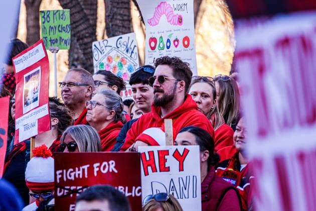 October 23, 2025, Edmonton, Alberta, Canada: Protesters hold placards expressing their opinion during the demonstration. Over 20,000 people with various signs speaking out about the state of education under the current Premier Danielle Smith, rallied outside the Alberta Legislature as the Throne Speech was being read in the legislature. Teachers have been on strike since October 7th and have rejected 2 offers from the Province. The Main Issues are Class Sizes, Educational Assistant Support, and wages. Teachers made an offer to the province, which has not been responded to. The Province is expected to introduce back to work legislation Monday. Edmonton Canada - ZUMAs197 20251023_aaa_s197_352 Copyright: xRonxPalmerx