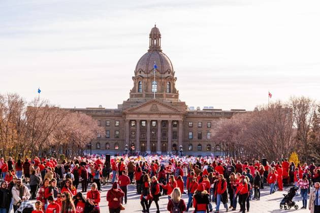 October 23, 2025, Edmonton, Alberta, Canada: Protesters gather outside the Alberta Legislature during the demonstration. Over 20,000 people with various signs speaking out about the state of education under the current Premier Danielle Smith, rallied outside the Alberta Legislature as the Throne Speech was being read in the legislature. Teachers have been on strike since October 7th and have rejected 2 offers from the Province. The Main Issues are Class Sizes, Educational Assistant Support, and wages. Teachers made an offer to the province, which has not been responded to. The Province is expected to introduce back to work legislation Monday. Edmonton Canada - ZUMAs197 20251023_aaa_s197_361 Copyright: xRonxPalmerx