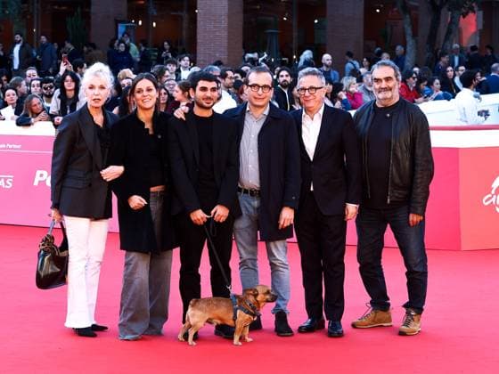 Rome: Rome Cinema Fest 2025, evening 11 - Red Carpet for the film Tienimi Presente. Pictured is Alberto Palmiero with his dog Jonny and Paolo Del Brocco. Rome  - ZUMAp169 20251024_zea_p169_874 Copyright: xMarcoxProvvisionatox