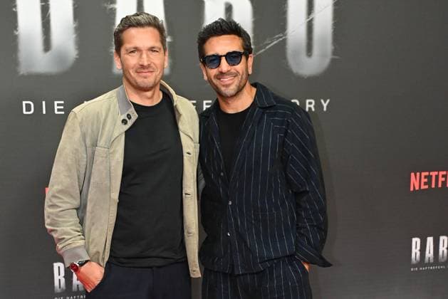 Paco Luca Nitsche and Elyas M Barek at the Babo Die Haftbefehl Story Netflix documentary premiere on 24 10 2025 at the Astor Film Lounge in Berlin Babo Netflix Premiere in Berlin