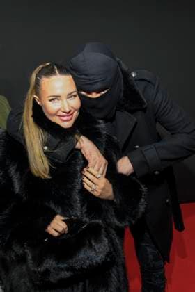abb Haftbefehl Nina Anhan with Aykut Anhan with balaclava on the red carpet of the special screening event of the Netflix documentary highlight Babo The Haftbefehl Story at the Astor Film Lounge on 24 10 2025in Berlin Berlin Germany