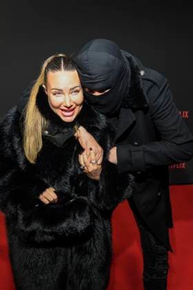 abb Haftbefehl Nina Anhan with Aykut Anhan with balaclava on the red carpet of the special screening event of the Netflix documentary highlight Babo The Haftbefehl Story at the Astor Film Lounge on 24 10 2025in Berlin Berlin Germany