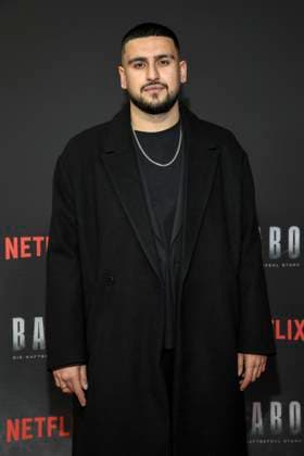 abb Haftbefehl Deniz Ercan as a guest on the red carpet of the special screening event of the Netflix documentary highlight Babo The Haftbefehl Story at the Astor Film Lounge on 24 10 2025in Berlin Berlin Germany