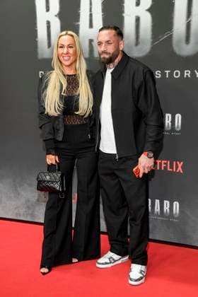 abb Haftbefehl Dominique Eckerlin and Christian Eckerlin as guests on the red carpet of the special screening event of the Netflix documentary highlight Babo The Haftbefehl Story at the Astor Film Lounge on 24 10 2025in Berlin Berlin Germany
