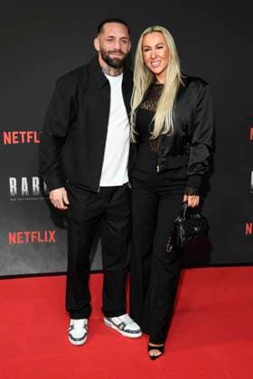 abb Haftbefehl Christian Eckerlin with Dominique Eckerlin as guests on the red carpet of the special screening event of the Netflix documentary highlight Babo The Haftbefehl Story at the Astor Film Lounge on 24 10 2025in Berlin Berlin Germany