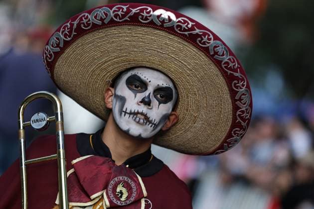 (251027) -- MEXICO CITY, Oct. 27, 2025 -- A participant with facial makeup takes part in the Catrinas Parade in Mexico City, capital of Mexico, on Oct. 26, 2025. The Catrinas Parade was held on Sunday ahead of the Day of the Dead. (Photo by Francisco Canedo Xinhua) MEXICO-MEXICO CITY-PARADE-CATRINAS LixMengxin 