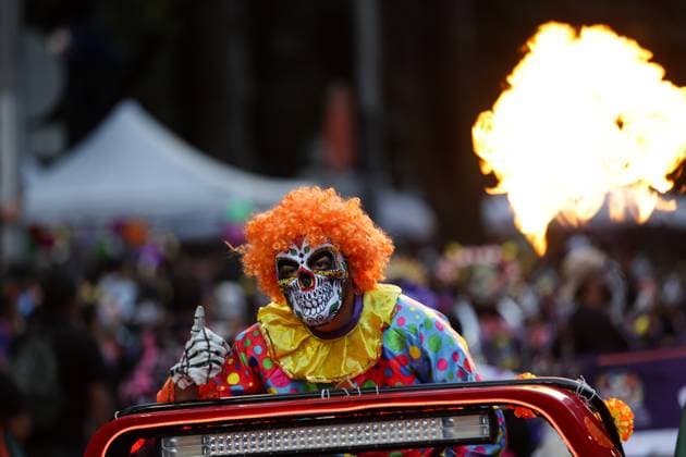 (251027) -- MEXICO CITY, Oct. 27, 2025 -- A participant with facial makeup takes part in the Catrinas Parade in Mexico City, capital of Mexico, on Oct. 26, 2025. The Catrinas Parade was held on Sunday ahead of the Day of the Dead. (Photo by Francisco Canedo Xinhua) MEXICO-MEXICO CITY-PARADE-CATRINAS LixMengxin 