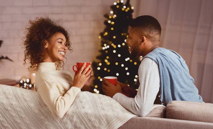 Happy Christmas couple drinking tea on sofa at home Happy Christmas couple drinking tea on sofa at home, enjoying cozy winter evening, model released, , 61232258.jpg RECORD DATE NOT STATED