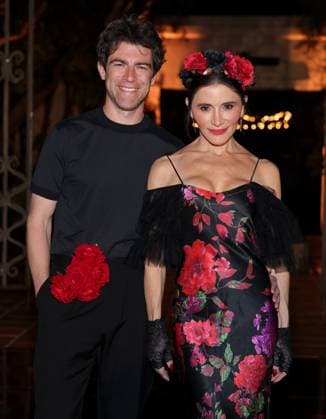 Max Greenfield and Tess Sanchez attend the 2025 Dia De Muertos Gala Presented by Lexus, Tequila Don Julio, Nike, DNERO, Calamigos Ranch and Maremoto at the Los?Angeles? River?Center?&?Gardens in Los Angeles on Thursday, October 30, 2025.  LAP20251030093 GREGxGRUDT