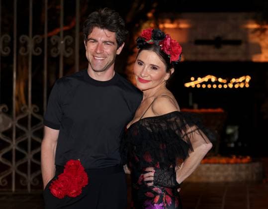Max Greenfield and Tess Sanchez attend the 2025 Dia De Muertos Gala Presented by Lexus, Tequila Don Julio, Nike, DNERO, Calamigos Ranch and Maremoto at the Los?Angeles? River?Center?&?Gardens in Los Angeles on Thursday, October 30, 2025.  LAP20251030095 GREGxGRUDT