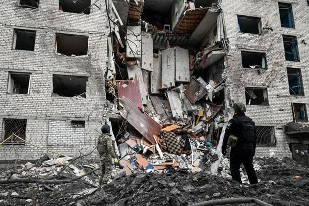 National Police officers examine the place of impact of a Russian missile outside a hostel, destroyed by an overnight Russian missile and drone attack, Zaporizhzhia, Ukraine, October 30, 2025. Russian troops launched eight missiles and 20 drones at the southeastern Ukrainian city, killing two people and injuring 23. At least 12 apartment blocks were damaged, and a hostel was destroyed, where several floors collapsed. (Photo by Dmytro Smolienko Ukrinform) Zaporizhzhia hostel destroyed by Russian missile and drone strike  Copyright: xDmytroxSmolienkox