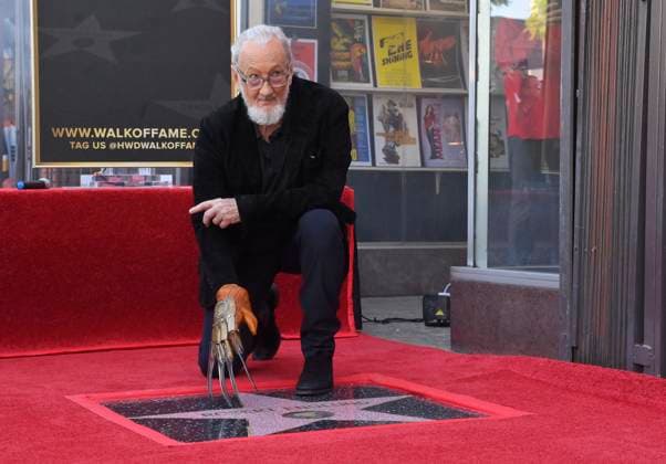 American actor and director Robert Englund, who is best known for his portrayal of the villainous Freddie Krueger kneels next to his star during an unveiling ceremony honoring him with the 2, 826th star on the Hollywood Walk of Fame in Los Angeles on Friday, October 31, 2025.  LAP2025103110 JIMxRUYMEN